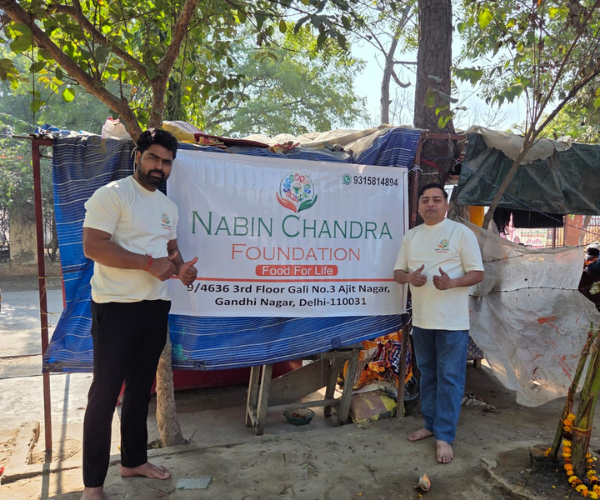 Two men standing together representing the Nabin Chandra Foundation