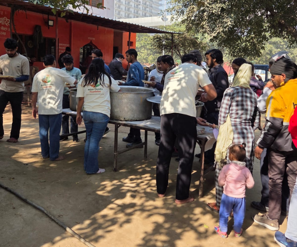 Large food distribution event taking place outside a building