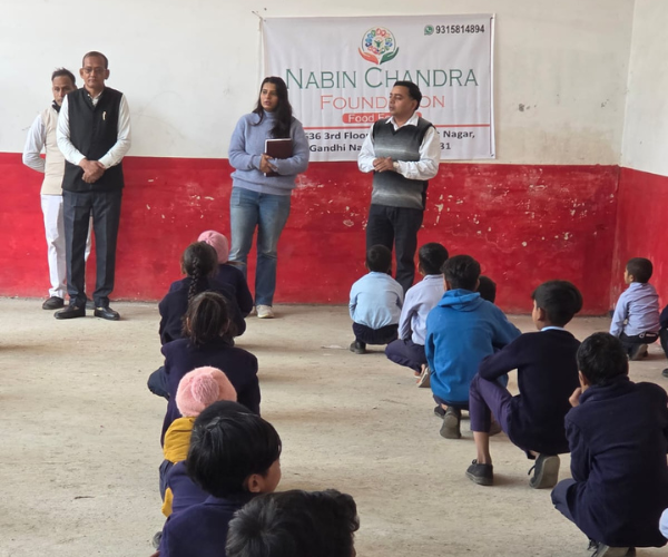 Woman talking to children in a school setting